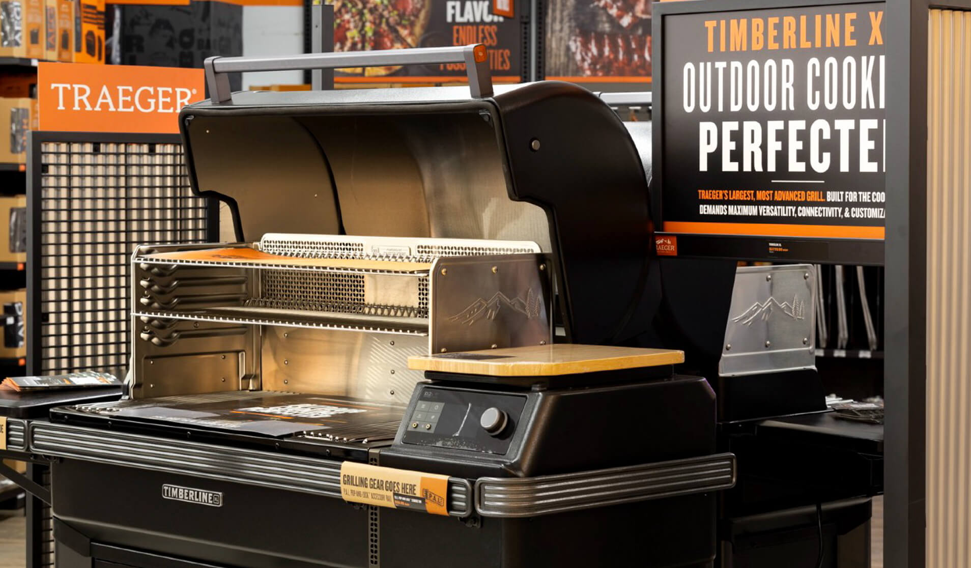 Traeger Timberline X grill on display in a retail environment with promotional signage.